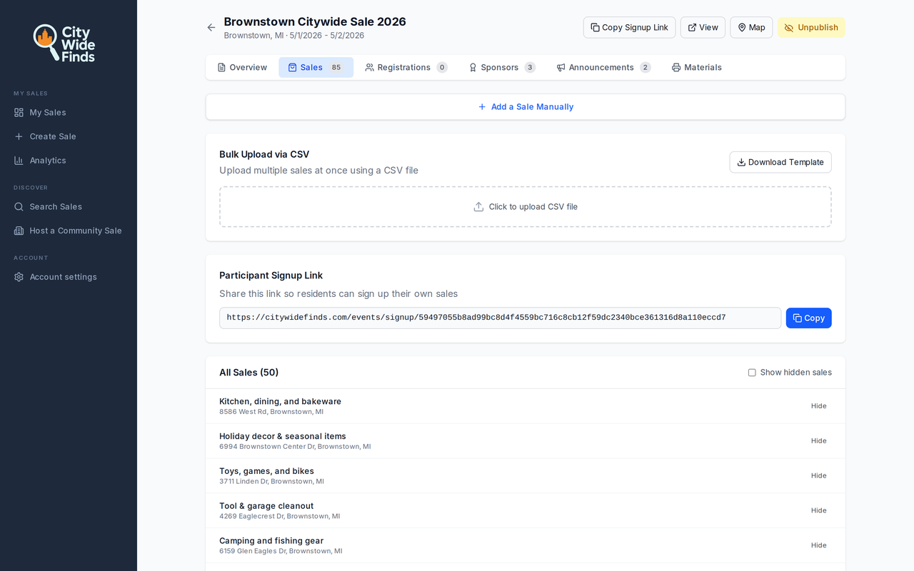 Organizer dashboard for the Brownstown Citywide Sale 2026 event — showing the Sales tab with 85 participating addresses, CSV bulk-upload, the participant signup link, and per-sale management controls